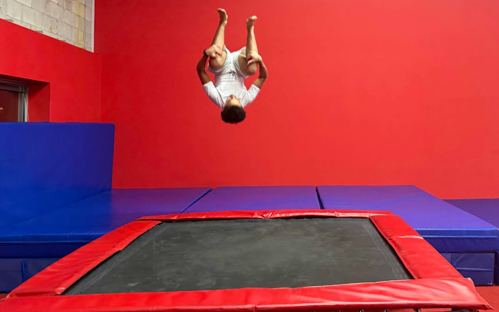 Trampoline and tumbling athlete in mid-air at Vortex
